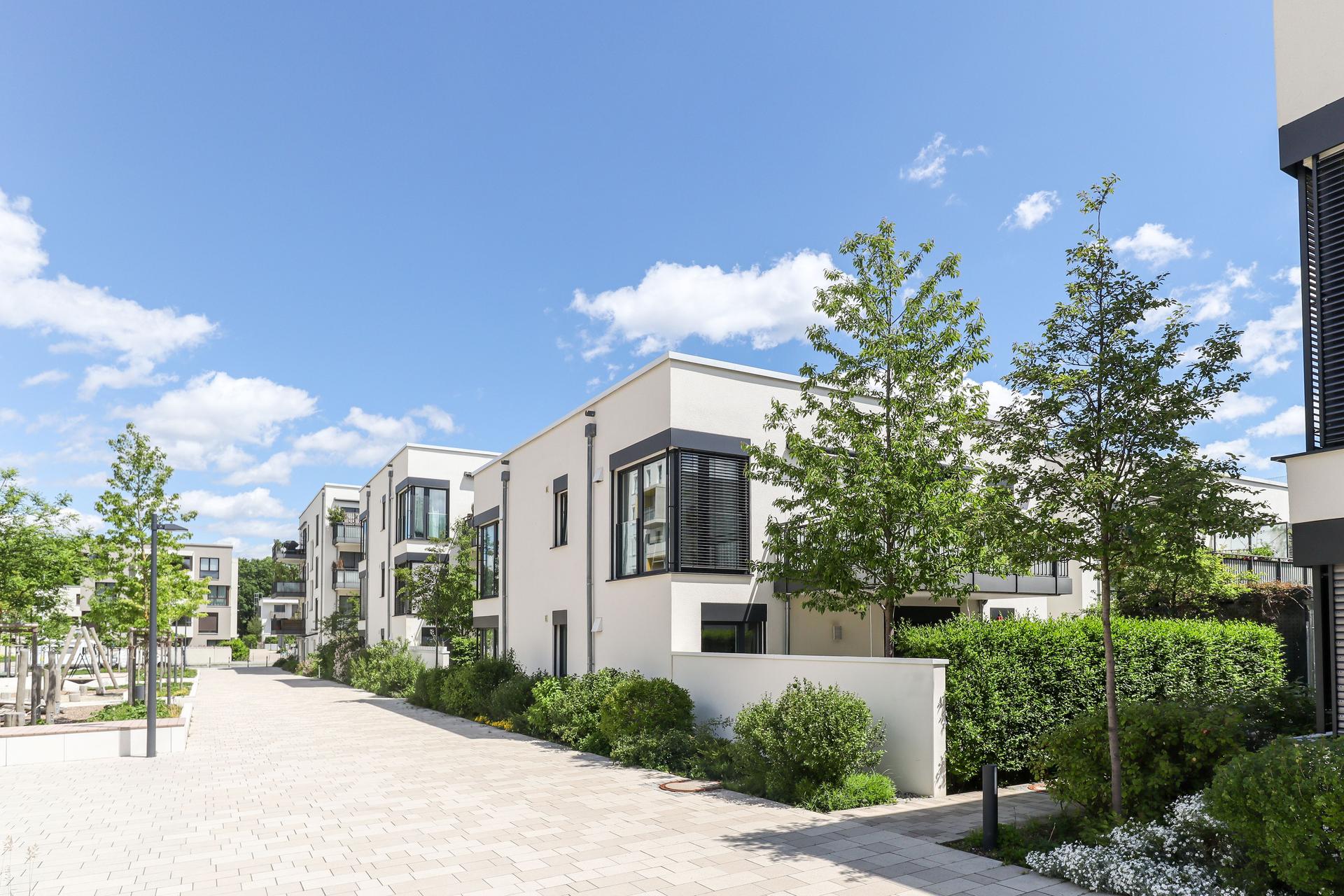 Residential area with ecological and sustainable green residential buildings, low-energy houses with apartments and green courtyard